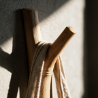 Macro view of the crotch of the fork with a linen strap resting in the crook.