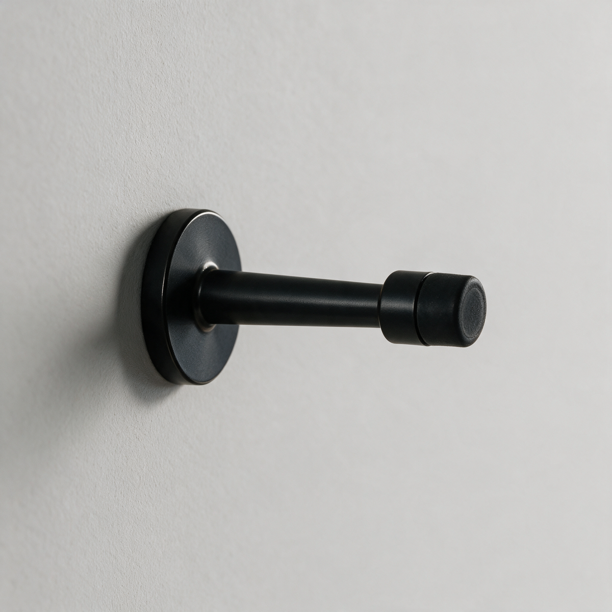 Fenwick Wall-Mounted Cylinder Door Stop — Black