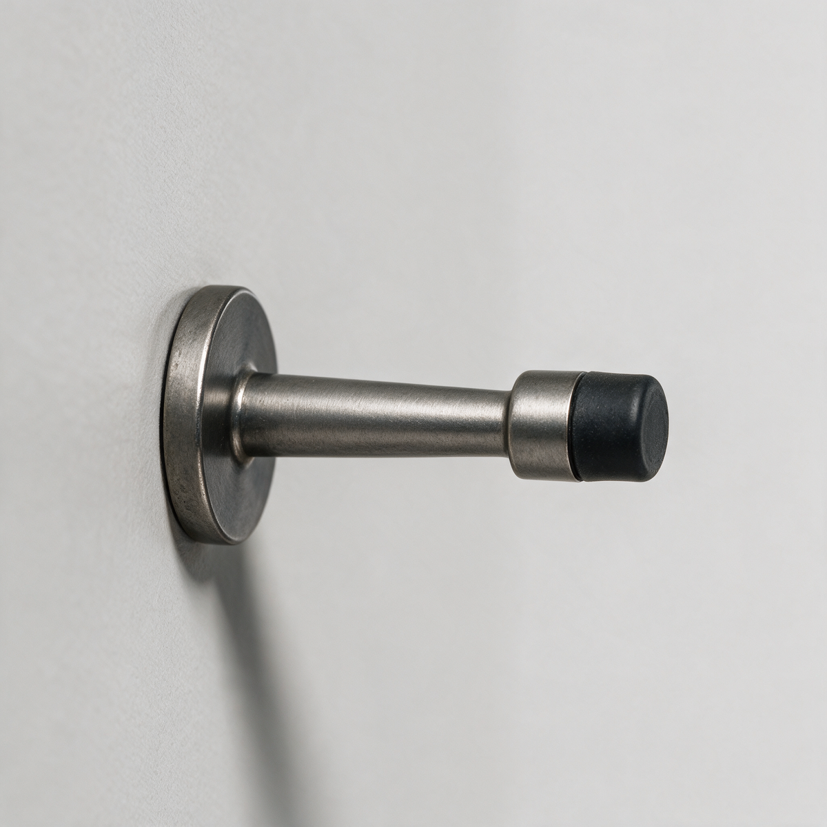 Fenwick Wall-Mounted Cylinder Door Stop — Grey