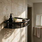 Matte black corner shower shelf with a slotted base on a travertine tiled bathroom wall