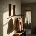Two Harlow rails in a sunlit entryway with coats and a bench
