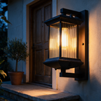 Thornbury lantern lit beside a timber front door at dusk
