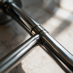 Solace mirror, close-up of the polished chrome arm