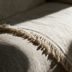Close-up of the frayed fringe and woven texture