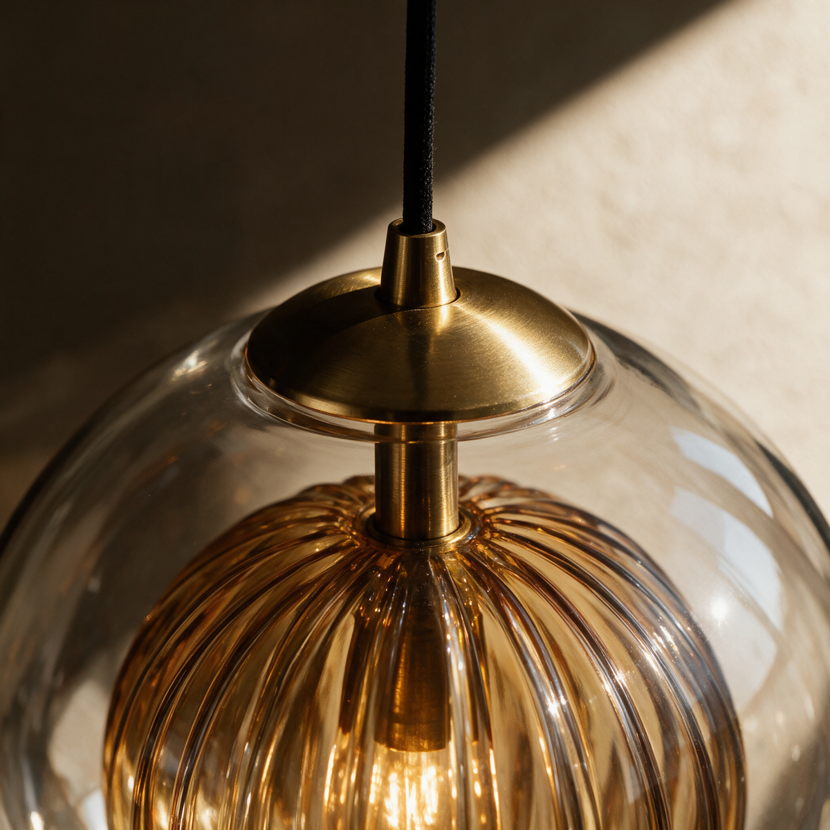 Close-up of the brass collar meeting the glass shade