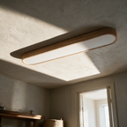 Linden ceiling light on a plaster ceiling in afternoon light