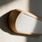Close-up of the oak frame meeting the frosted diffuser