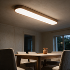 Linden ceiling light lit above a pale oak dining table