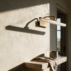 Laurel vanity light on a plaster wall in afternoon light