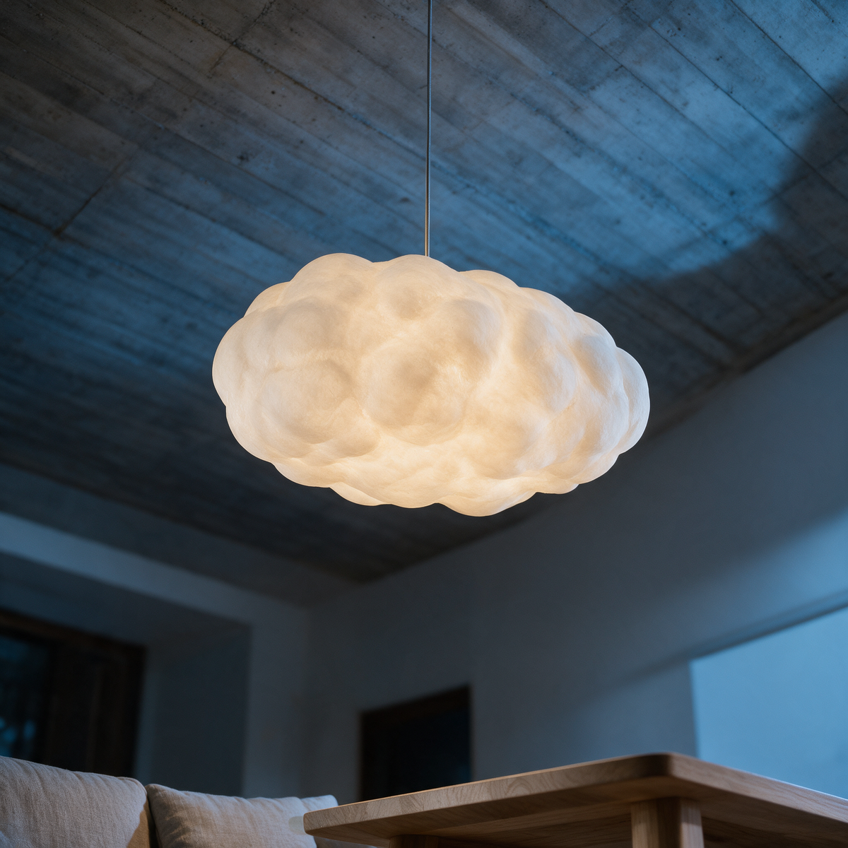 Drift cloud pendant seen from below in a double-height room