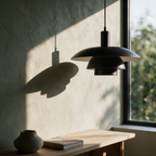 Weald pendant unlit beside a window, layers in raking light