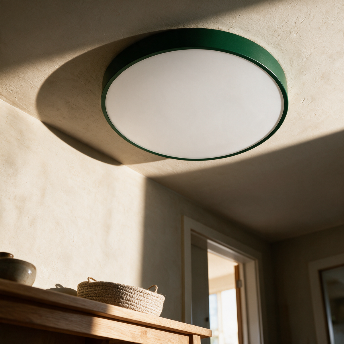 Green Slate disc on a hallway ceiling in afternoon light
