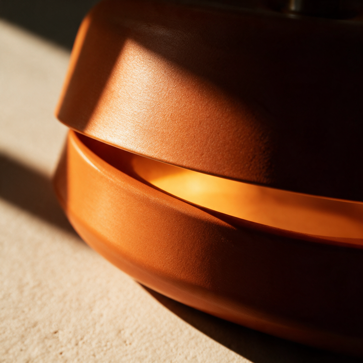 Close-up of light escaping through the gap between two rings