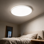 Reed ceiling light lit above a bed