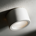Close-up of the matte white housing and recessed diffuser