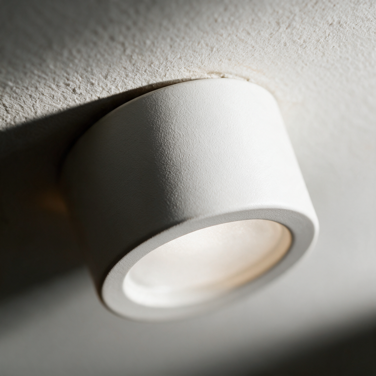 Close-up of the matte white housing and recessed diffuser