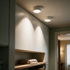Two downlights washing light down a run of cabinetry