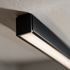 Close-up of the slim black extrusion and the continuous diffuser
