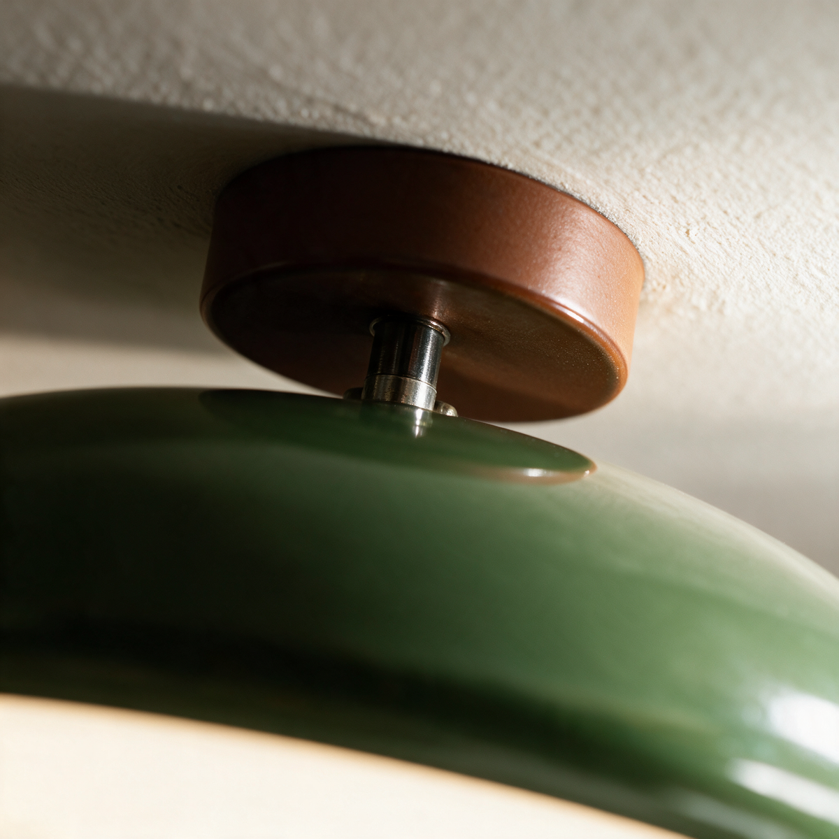 Close-up of the enamelled dome meeting the short drop stem and canopy