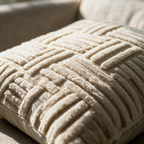 Macro detail of the raised four-way rib basket-weave texture on the cushion cover.