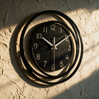 The clock alone on a textured plaster wall with its curling frame casting shadows