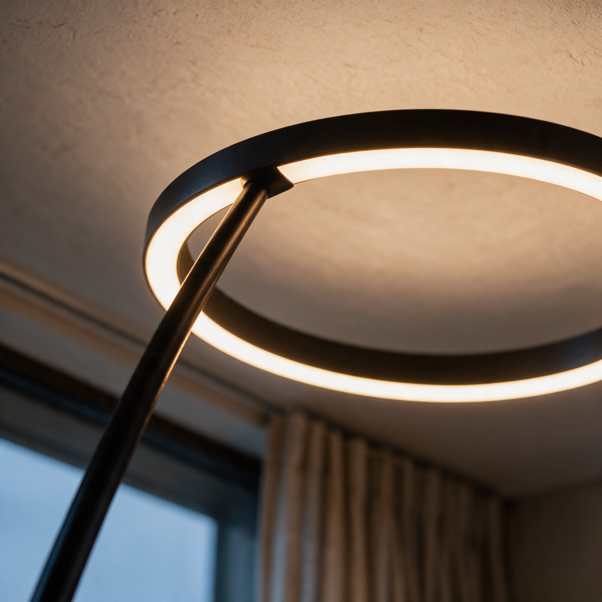 Close-up of where the slim arc meets the glowing circular ring.