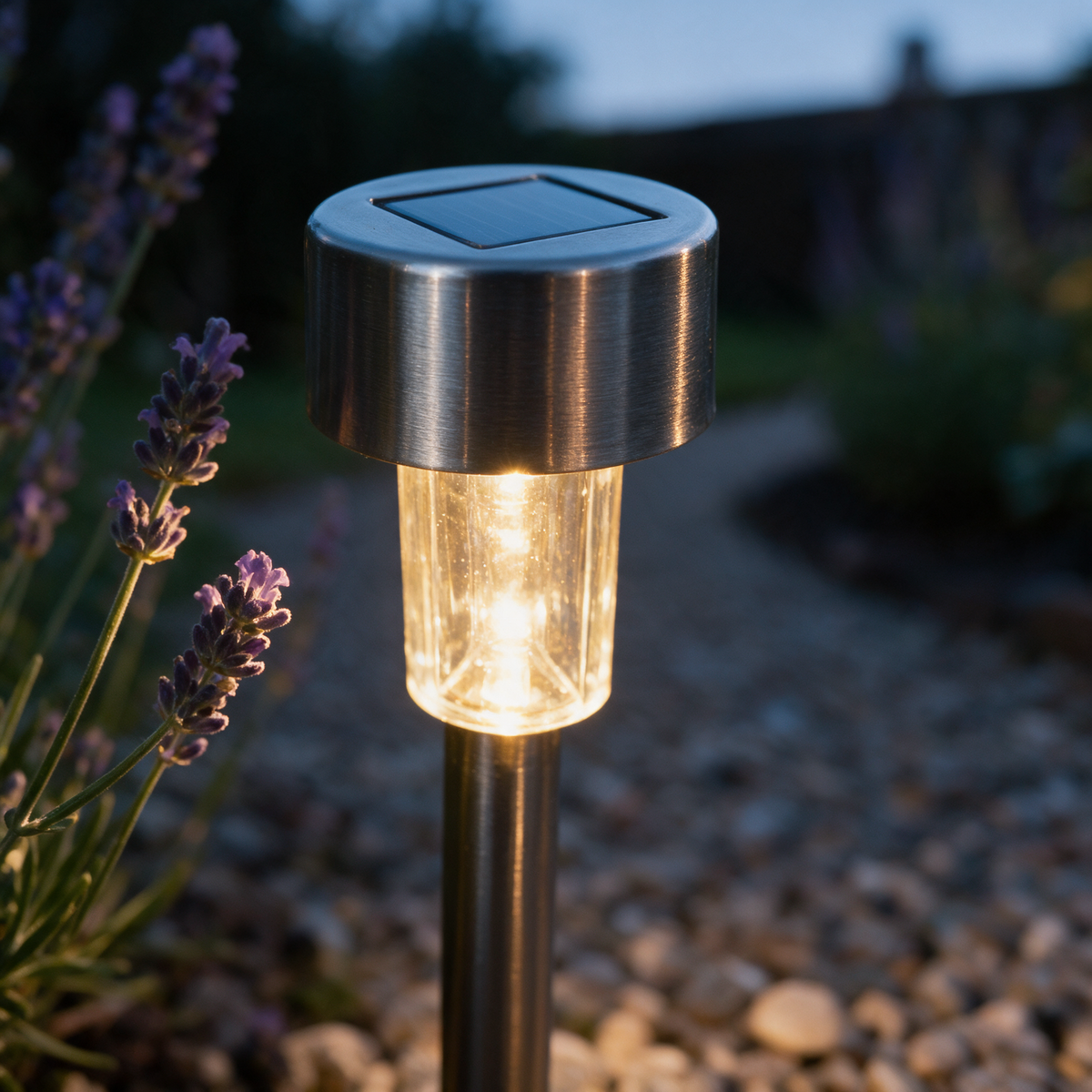 Close-up of the capped head with the LED glowing beneath the solar panel.