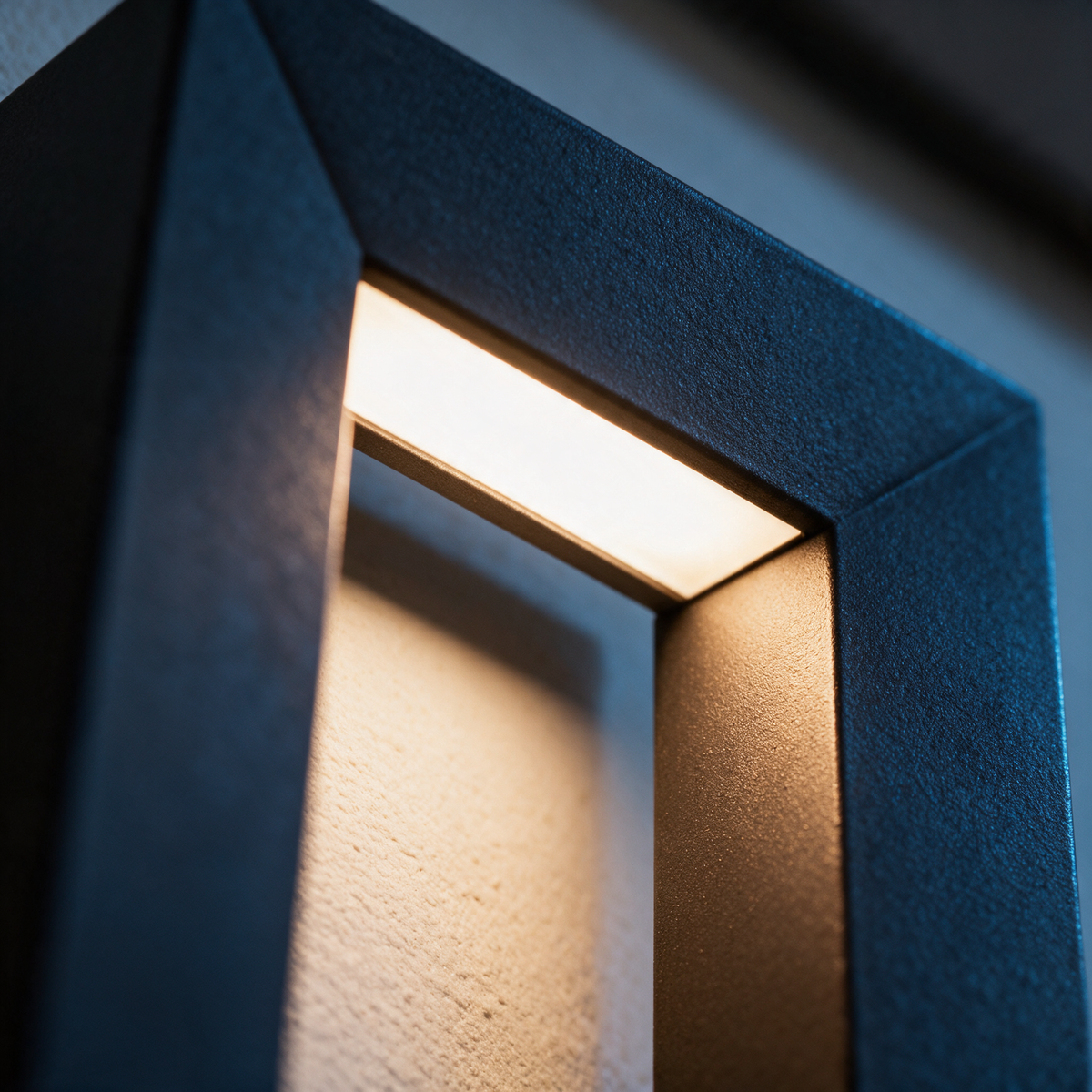 Macro close-up of a corner of the hollow slot with the LED-lit inner edges glowing.